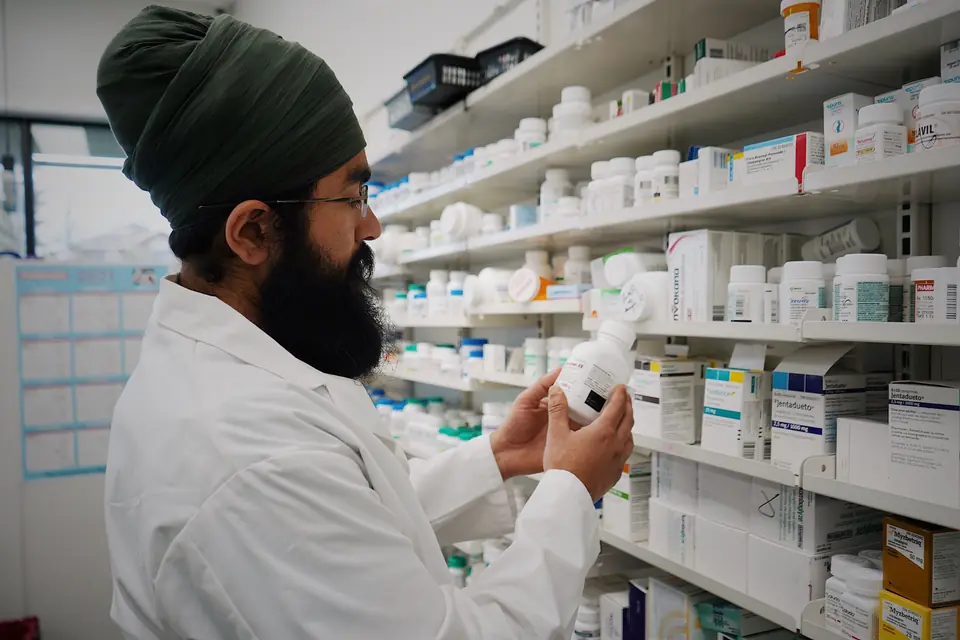 Pharmacist reviewing medication inventory