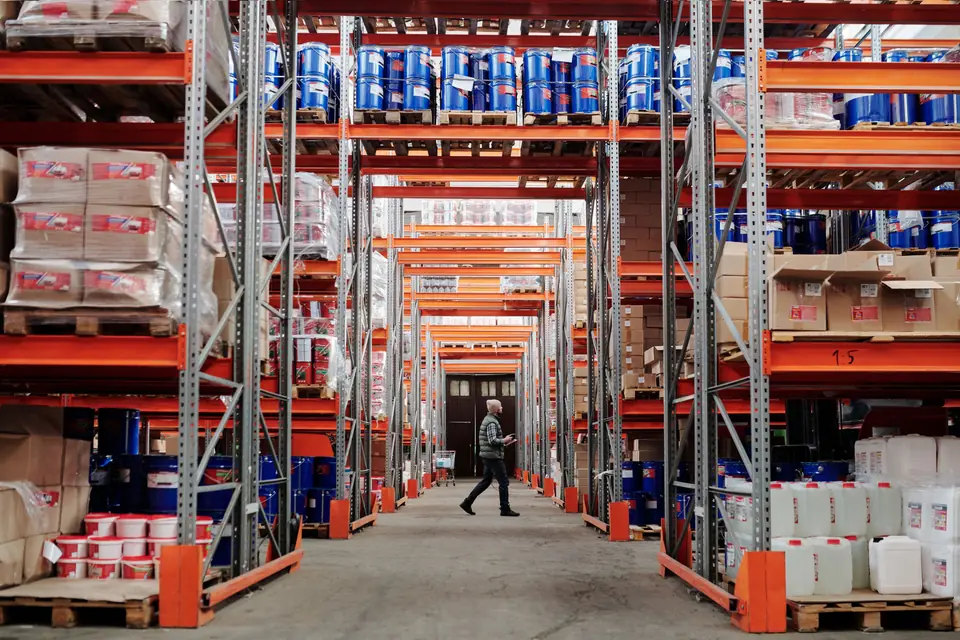 Warehouse with racks and palletized goods