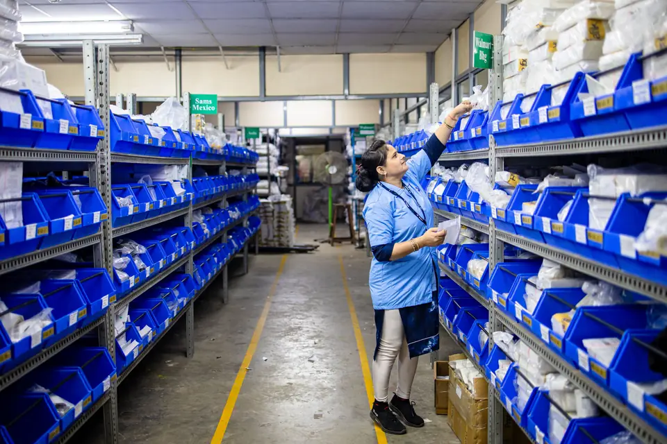 Warehouse associate picking orders in a distribution center