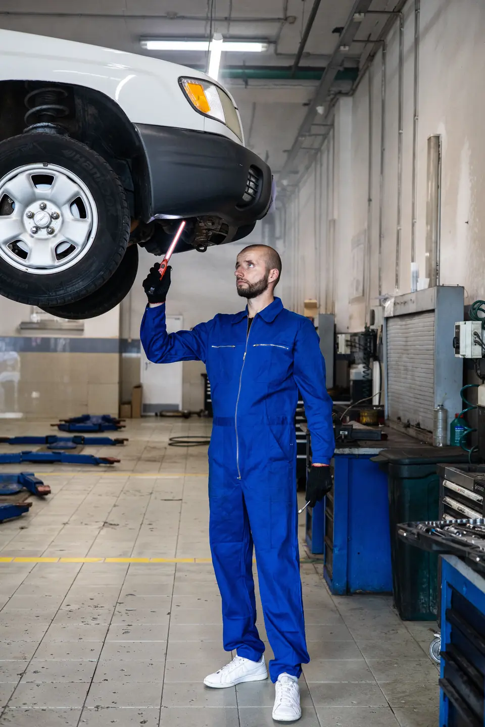 Mechanic in coveralls at the shop
