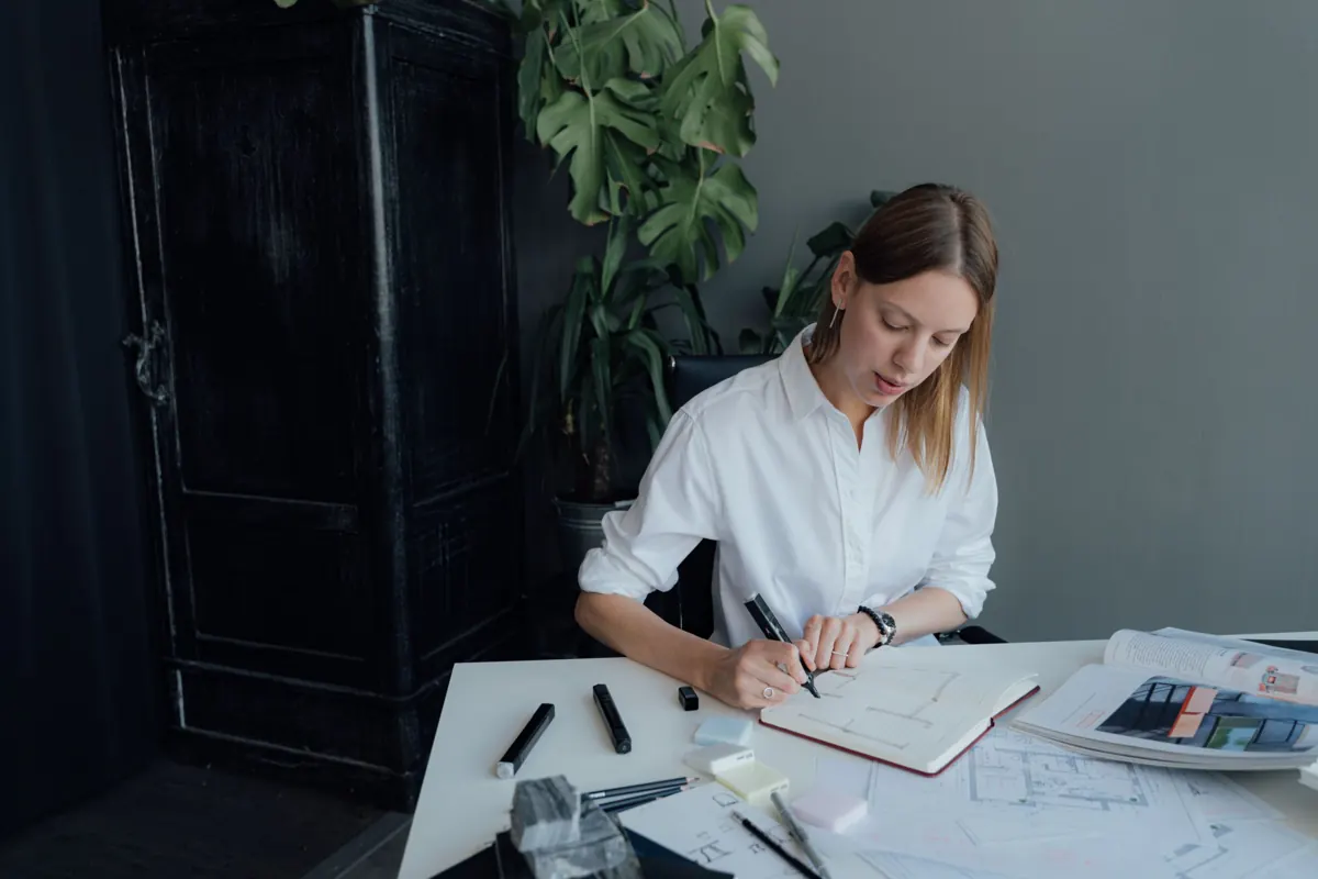 HR specialist reviewing documents at her desk